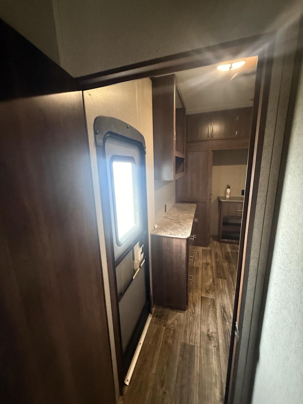 Bedroom with its own exterior door and dresser