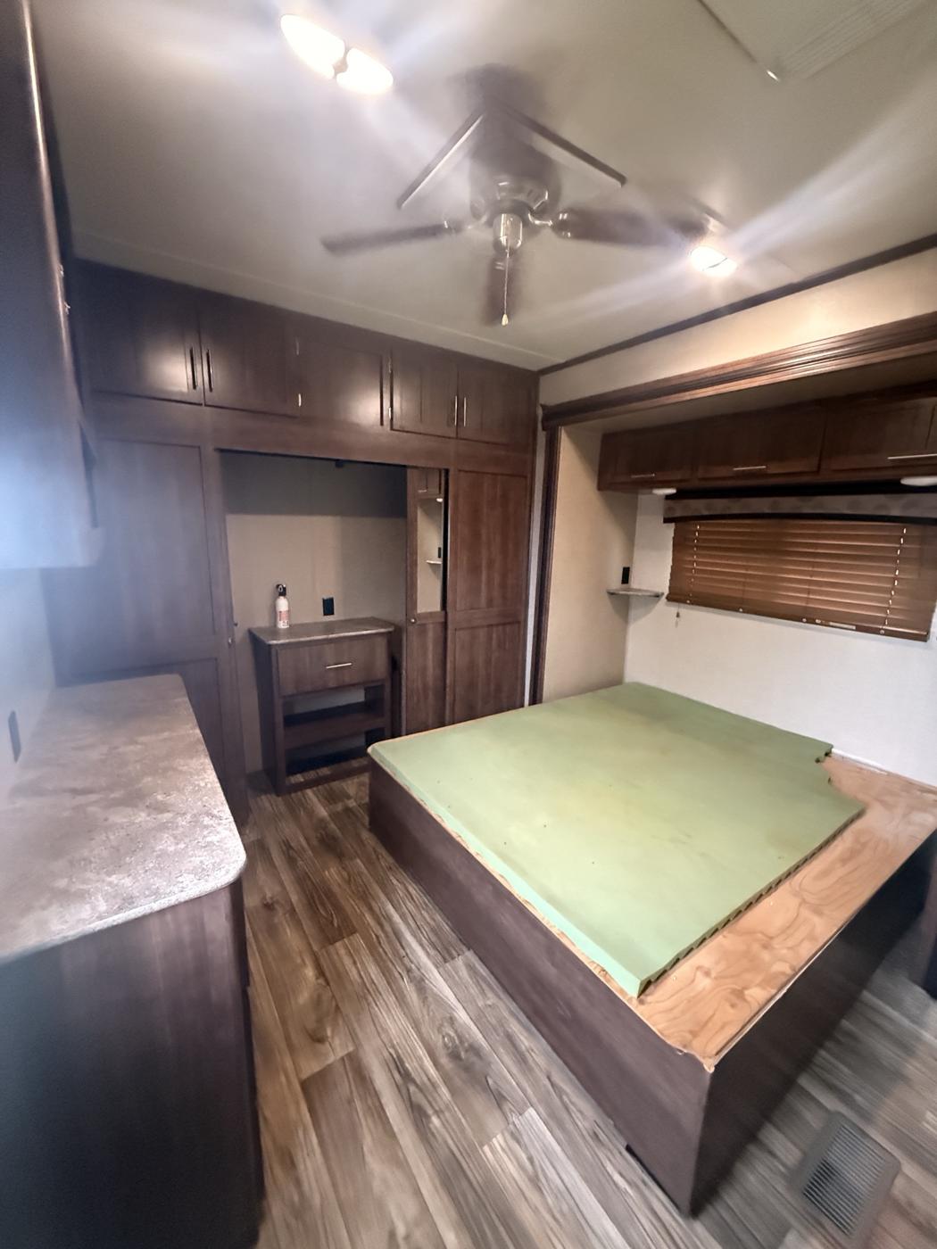Rear bedroom with wall of cabinets