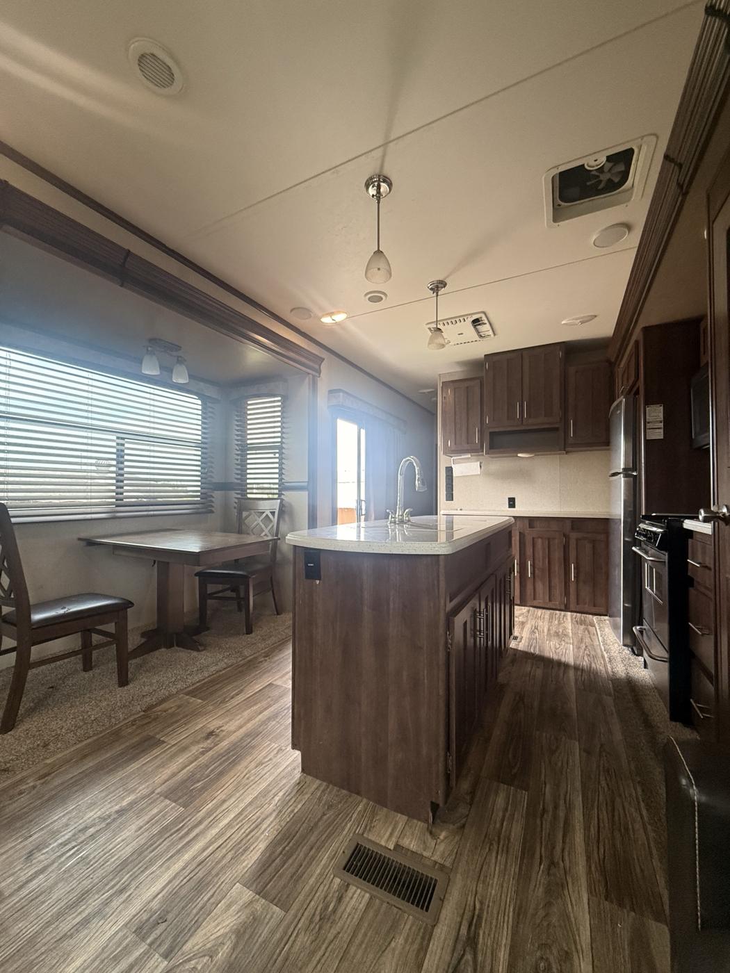 Kitchen island with sink and the dinette table by the window